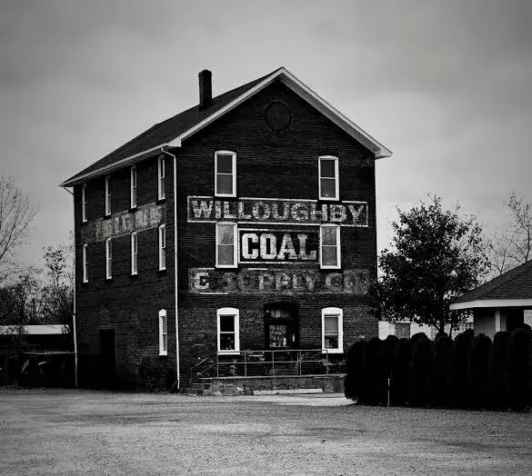 Black-and-white view of the historic Willoughby Coal brick façade