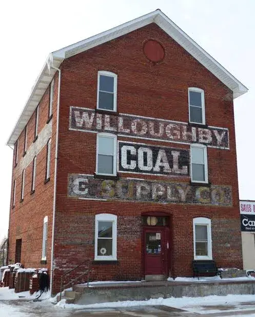 Willoughby Coal & Supply building in winter with painted signage