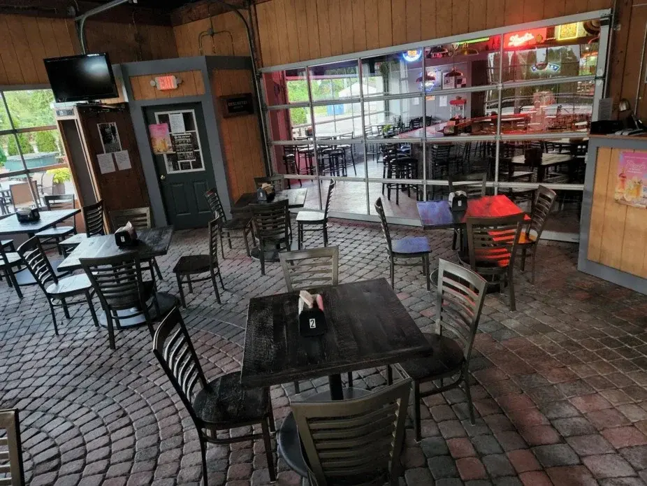 Interior dining space showing industrial brick and timber character at Spirits in Willoughby